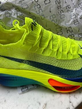 Nike Neon Yellow and Blue Running Shoe with Orange Accent